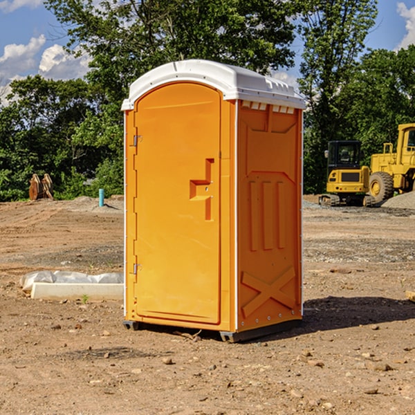 what is the cost difference between standard and deluxe portable toilet rentals in Winigan